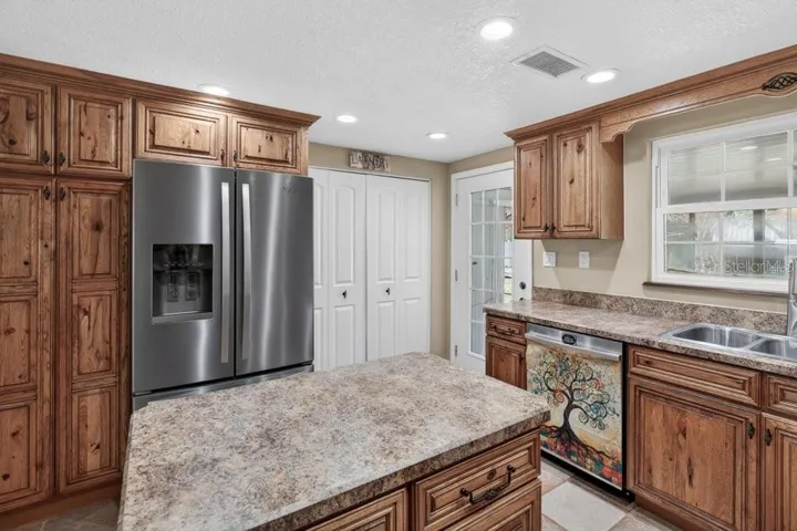 Side angle with laundry area behind the white doors.