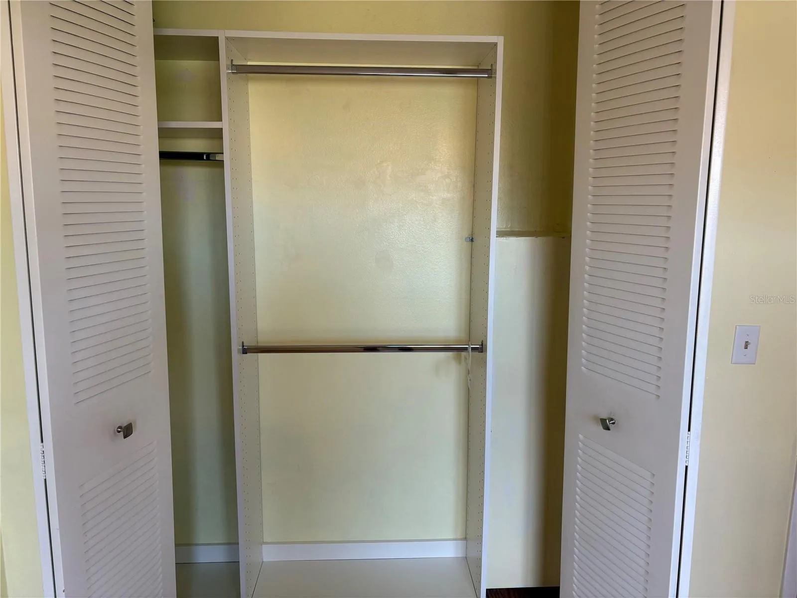 Bedroom 1 with plenty of custom closet space