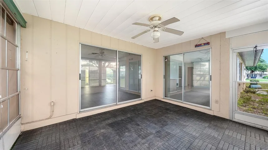 The back lanai can be entered from the living area and the kitchen area.