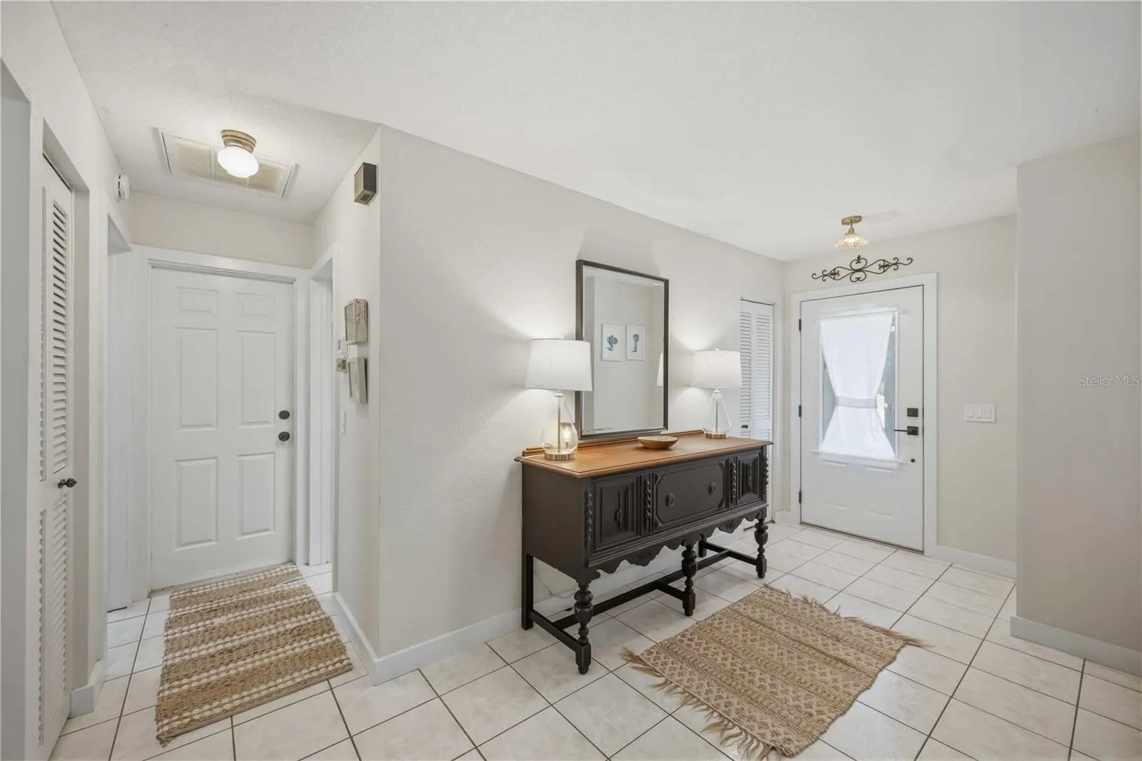 Welcoming entry foyer featuring neutral tones