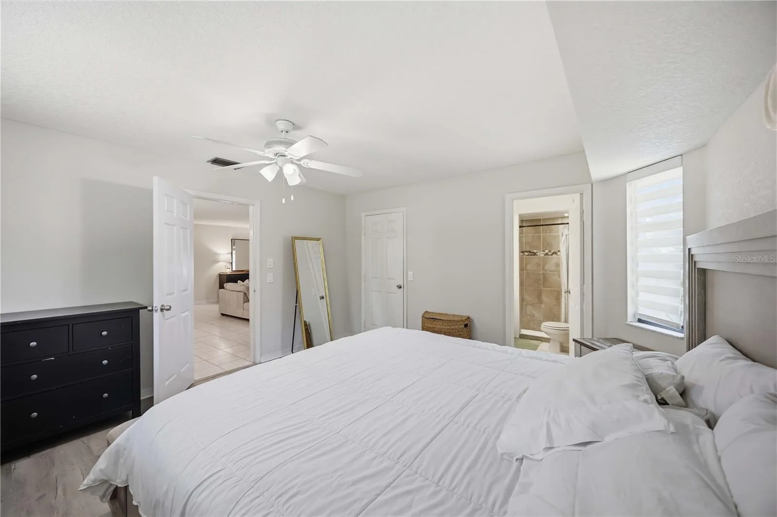 Primary bedroom and en suite with bath and shower