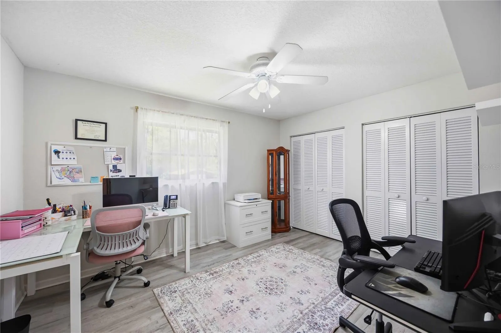 Guest bedroom/office with double closets