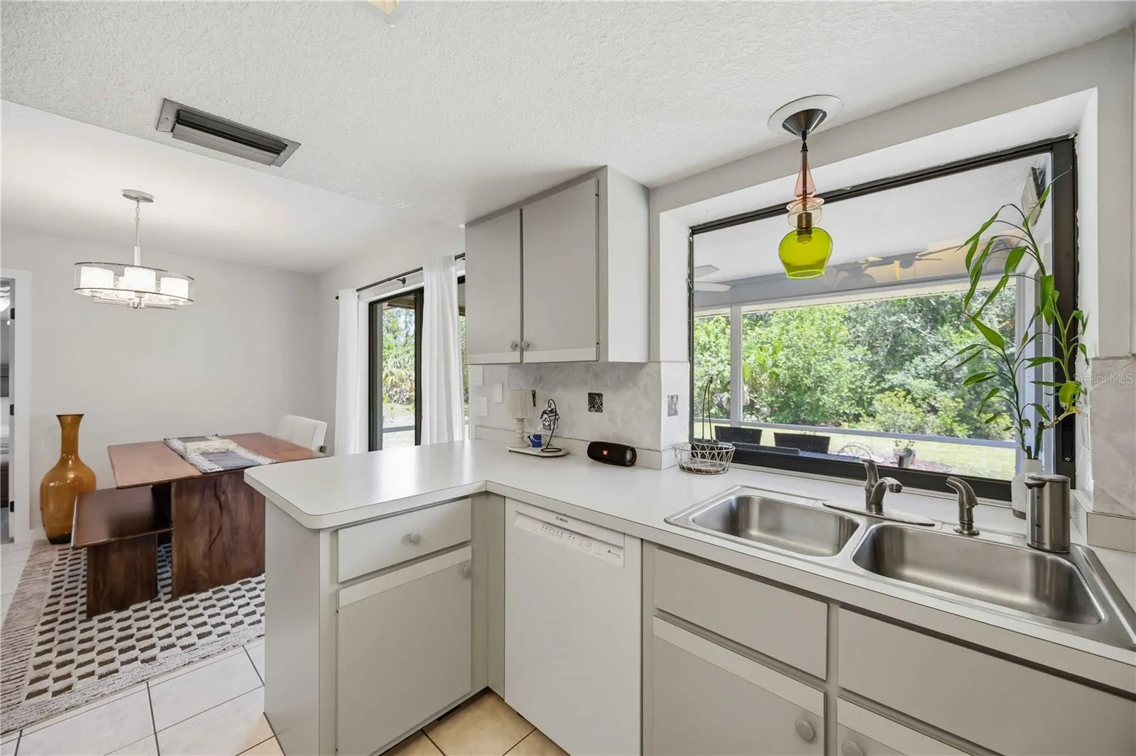 Kitchen overlooking scenic backyard