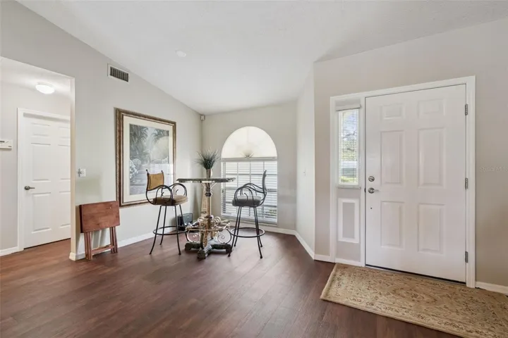 Formal Dining Room features an arched window that fills the space with natural light