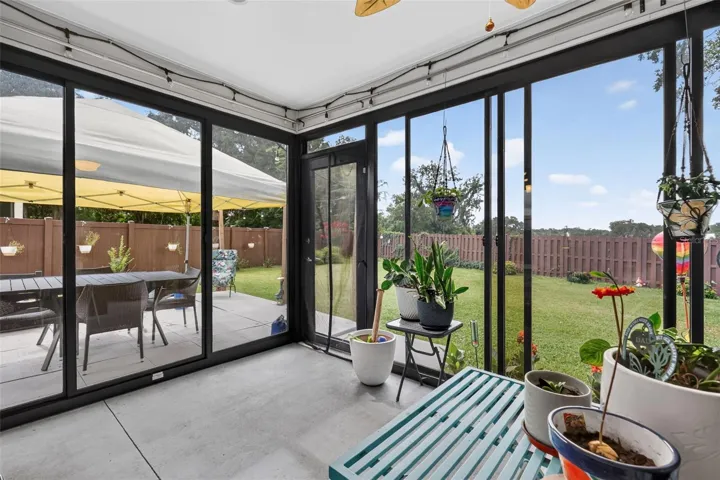 Glass-Enclosed Lanai with Patio and PRIVATE Fenced Yard with ROOM FOR A POOL