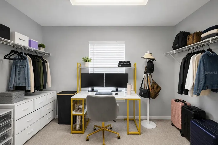 Massive walk in closet (virtually minimized clothes to showcase size).