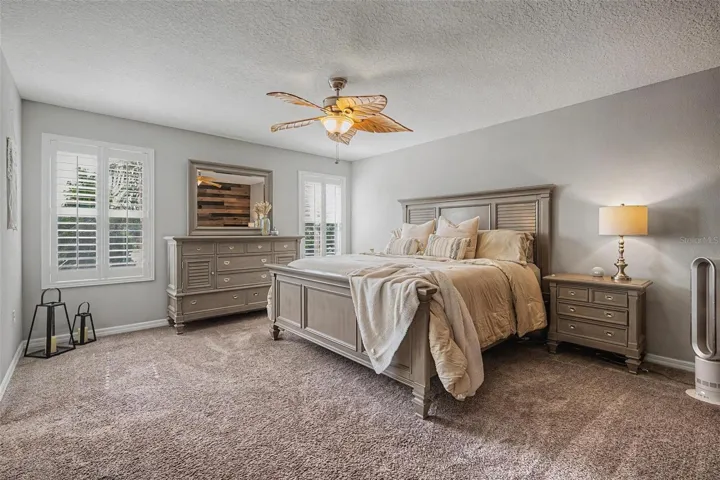 Oversized primary bedroom also with plantation shutters