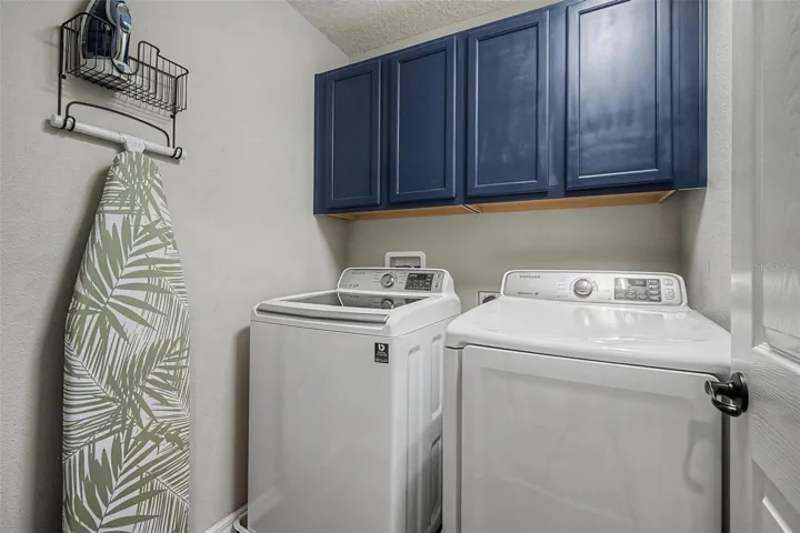 Walk-in laundry room with built-in storage