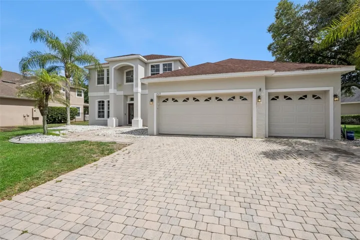 Grand curb appeal with a 3-car garage in Oviedo, FL.