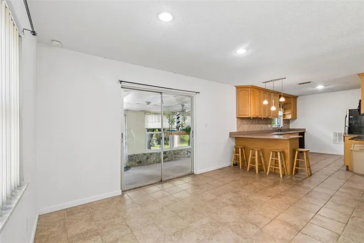 Dining area overlooking kitchen and back patio