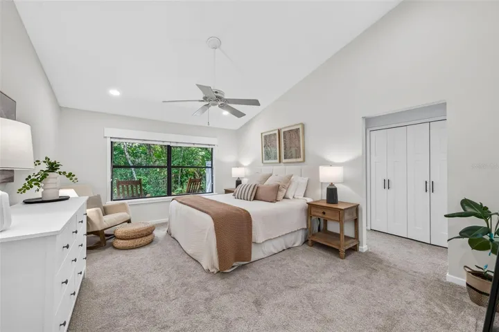 Owners suite with vaulted ceilings, recessed lighting and wonderful wooded view.