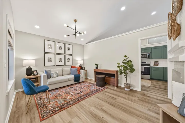 Living room with recessed lighting & new designer light fixture