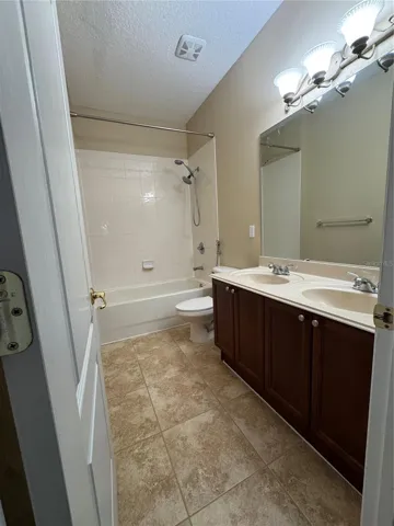 Second bathroom with dual sinks