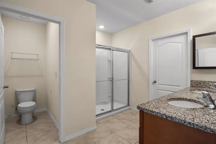 Primary bathroom with 2 sinks and walk-in shower