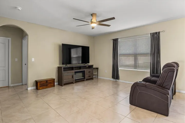 Large living room with view of backyard.