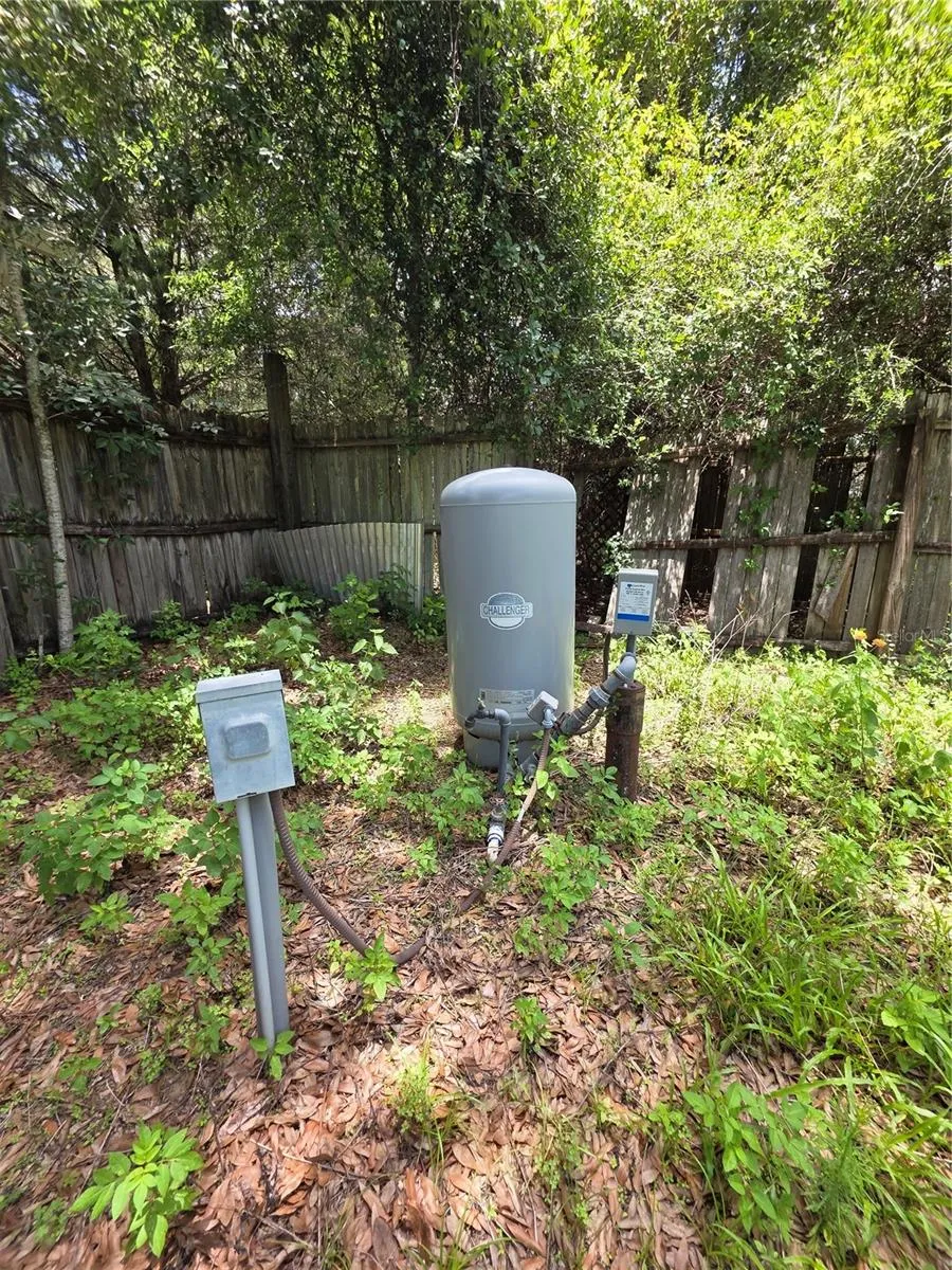 Well is nicely situated in the northwest corner of the backyard.