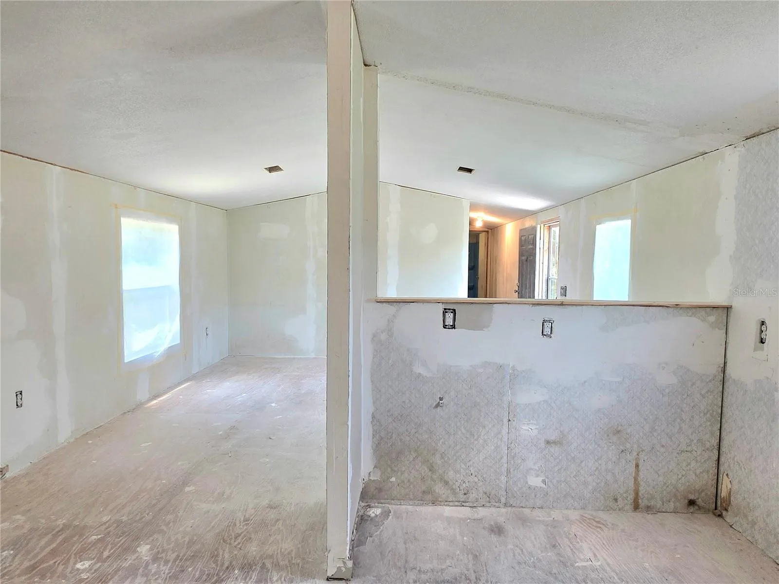 Dining area, kitchen, and living room.
