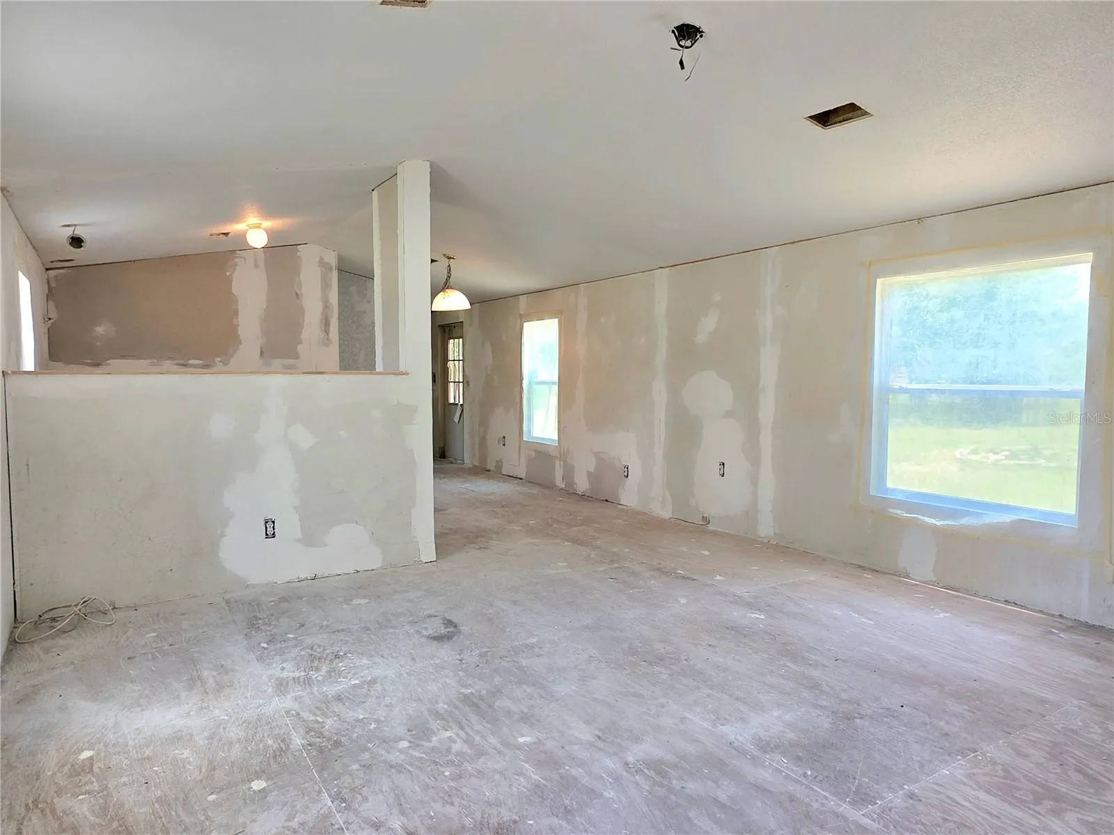 Living room, dining area, kitchen.