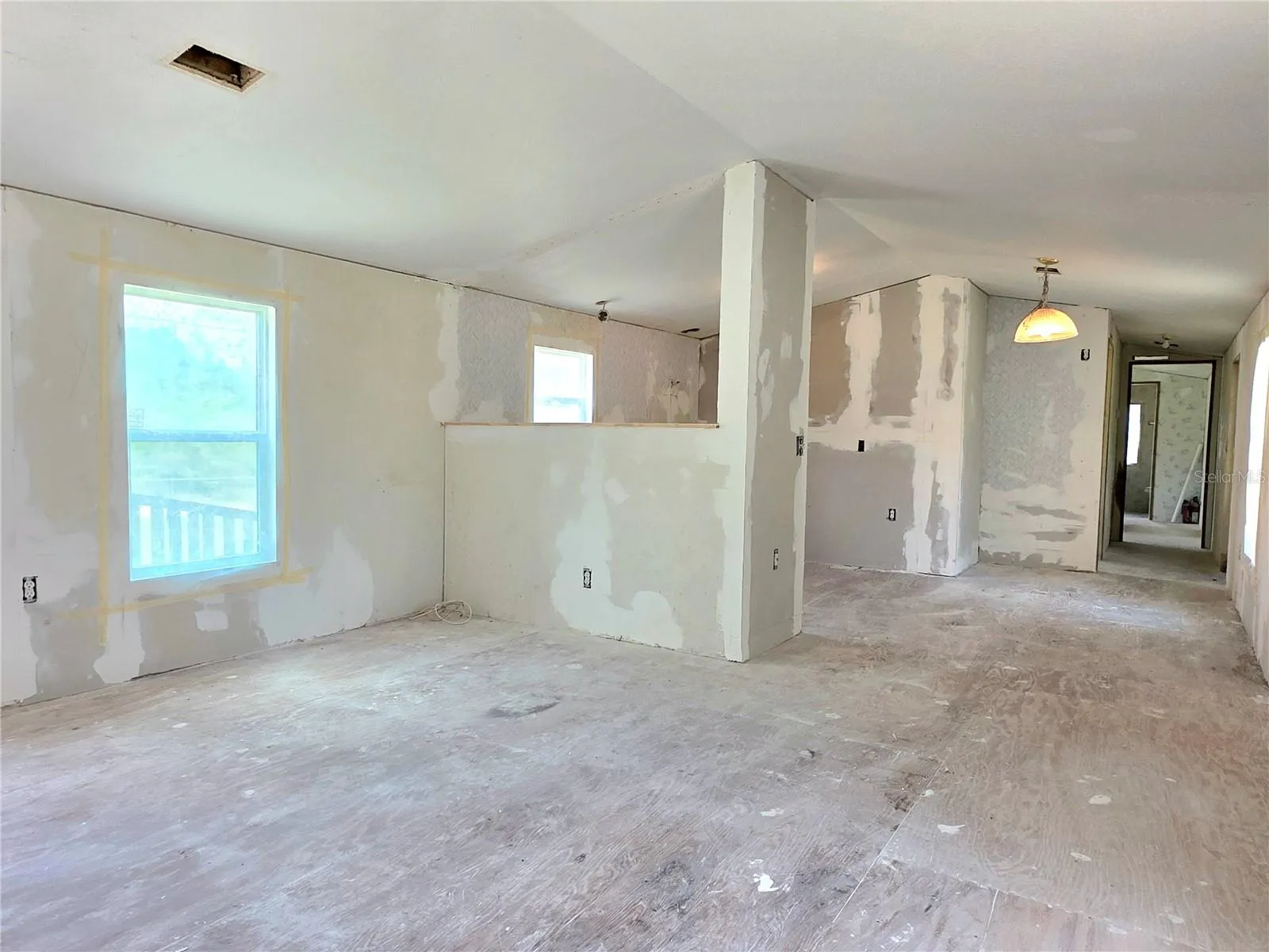 Living room, dining area, kitchen.