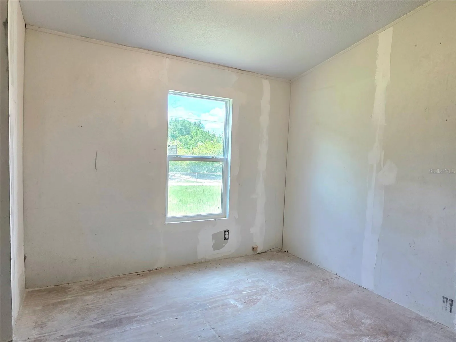 First bedroom with a laundry area.