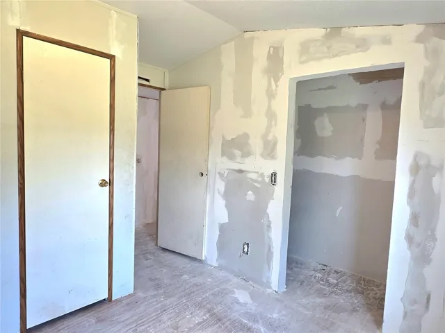 First bedroom with a laundry area.
