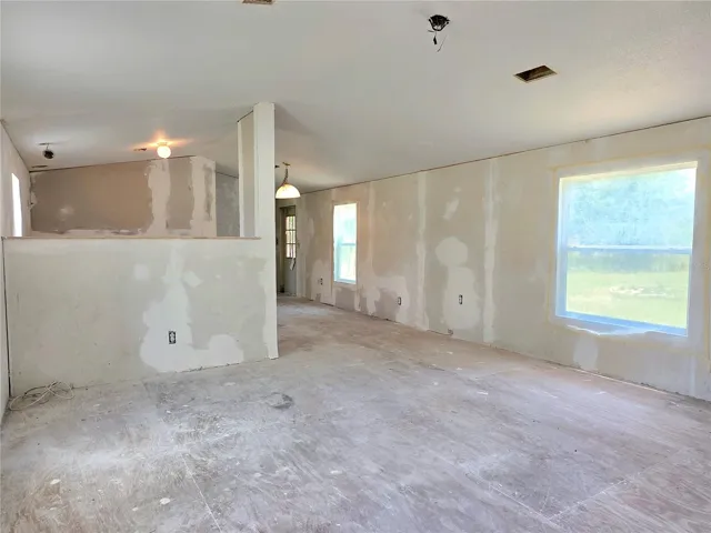 Living room, dining area, kitchen.