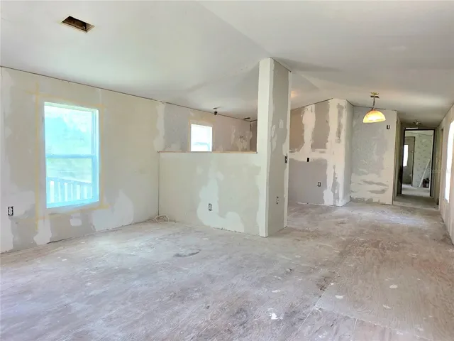 Living room, dining area, kitchen.