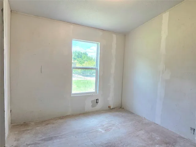 First bedroom with a laundry area.