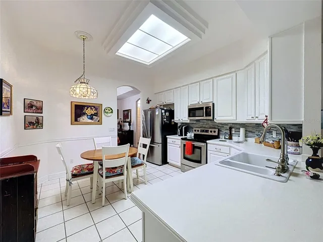 Kitchen has Corian Countertops