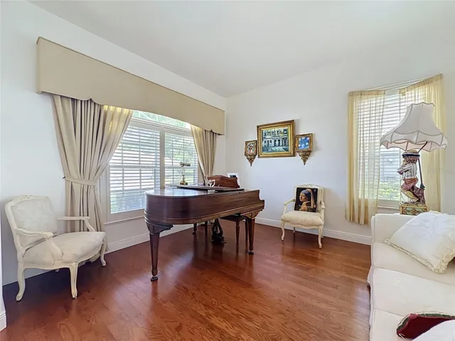 Living Room has wood floor- piano could remain