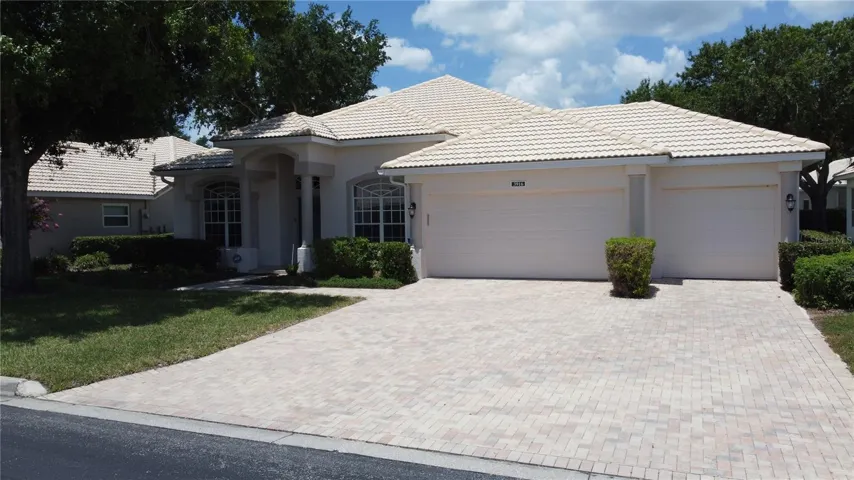 Home has a full 3 car garage and paver brick driveway