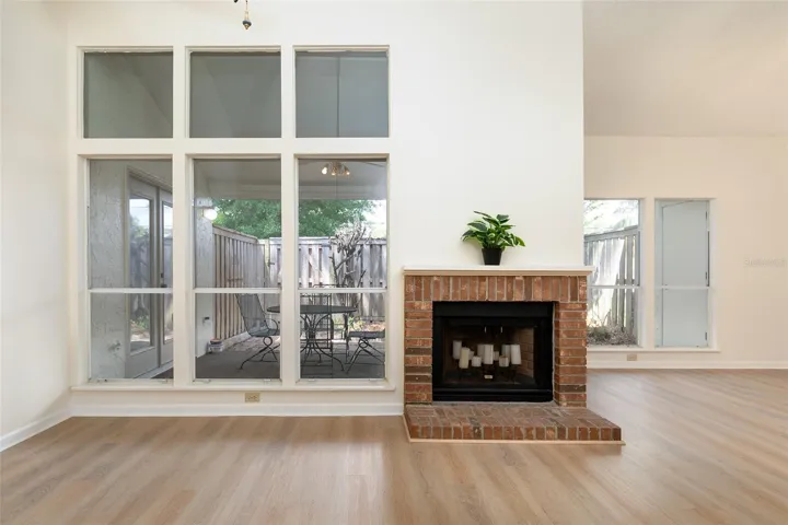 Woodburning fireplace in great room.