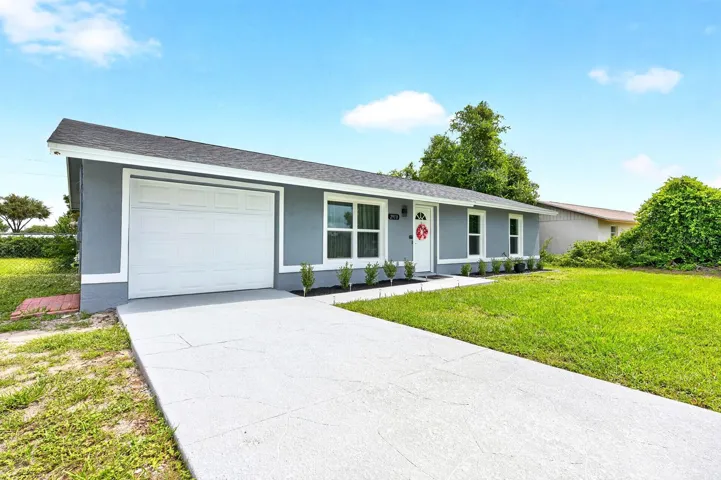 You'll appreciate the impressive list of RECENT UPDATES, including FRESH EXTERIOR PAINT (2026), a NEW ROOF (2026), NEW WINDOWS (2026), NEW FRONT DOOR (2026), NEW GARAGE DOOR (2026), NEW DRIVEWAY AND WALKWAY (2026), and all-NEW LANDSCAPING (2026), creating a fresh and welcoming first impression.
