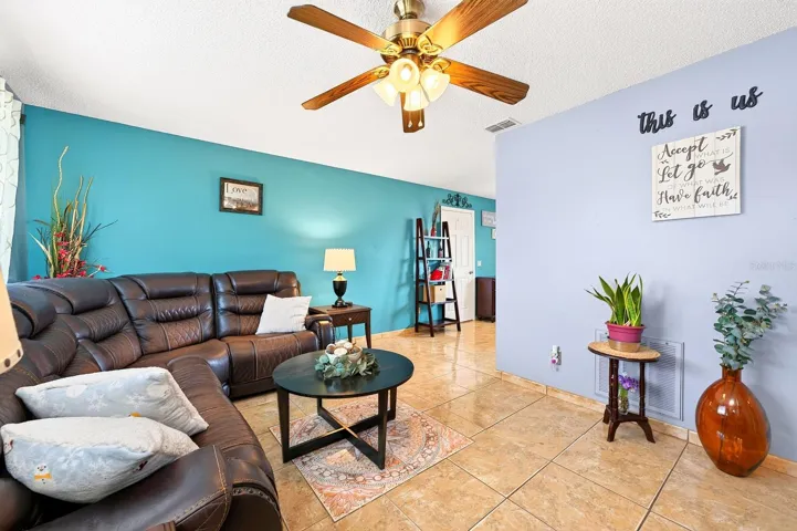 Step inside to discover a spacious Living Room filled with NATURAL LIGHT, creating a bright and inviting atmosphere.