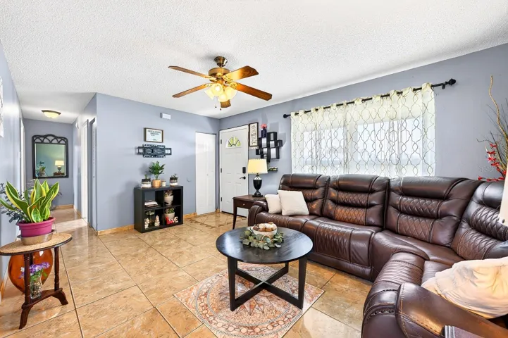 Step inside to discover a spacious Living Room filled with NATURAL LIGHT, creating a bright and inviting atmosphere.