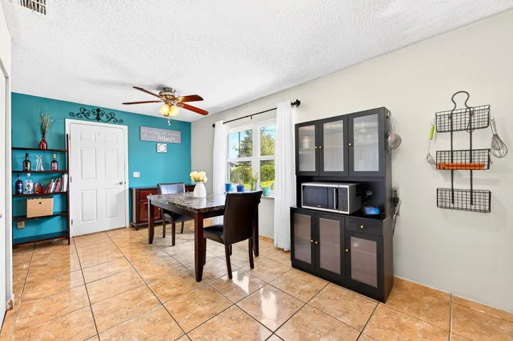 Adjacent to the Dining Area, the Kitchen offers both style and functionality.
