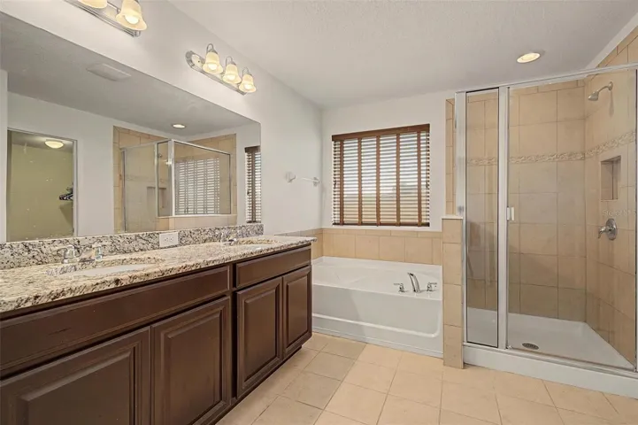 Granite countertops, soaking tub and a step-in shower