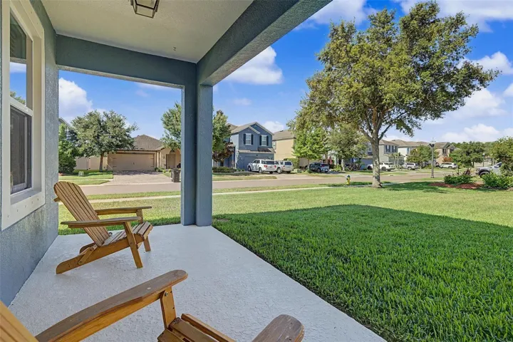 Back, covered porch to start or end your day