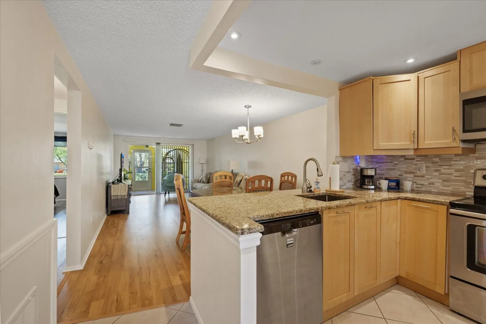 View from entry of open kitchen, living room and lanai