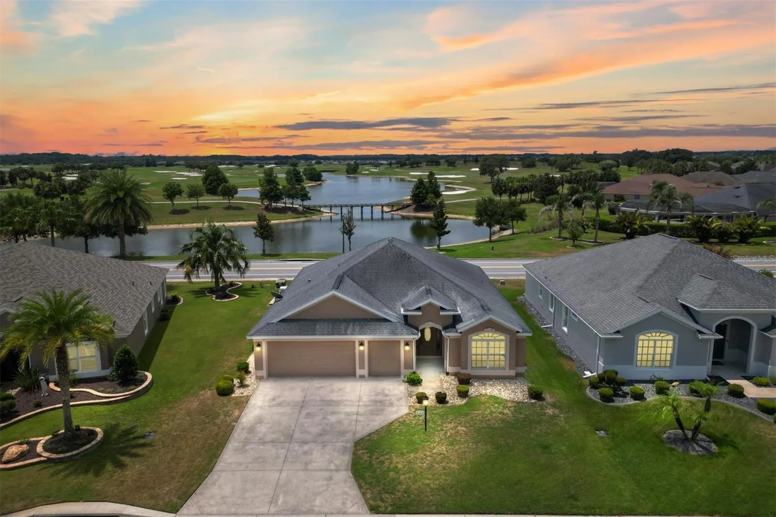 FRONT OF HOME WITH PAN0RAMIC WATER AND GOLF COURSE VIEW