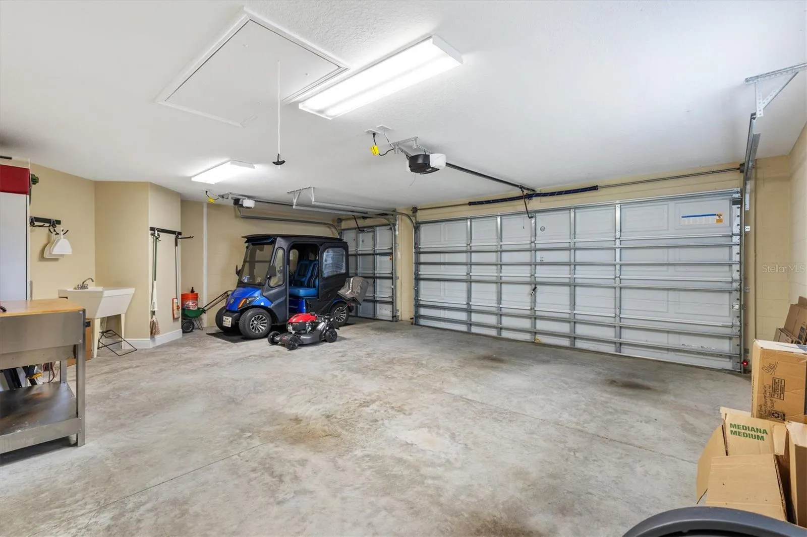2 CAR GARAGE + GOLF CART GARAGE
