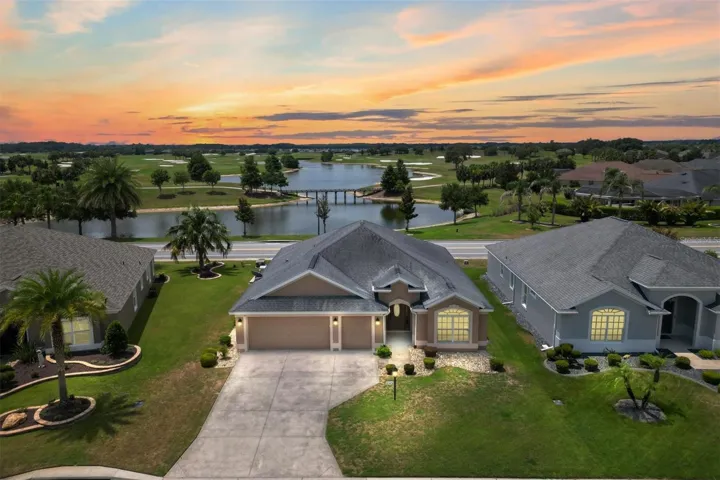 FRONT OF HOME WITH PAN0RAMIC WATER AND GOLF COURSE VIEW