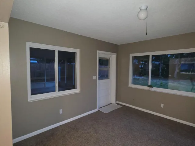 Florida room showing door to screened porch