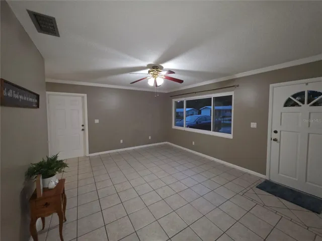 View of living room showing the door to garage