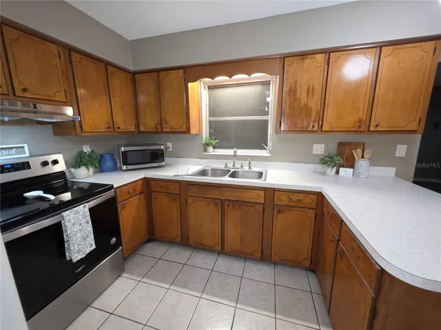 Spacious Kitchen with wooden cabinet