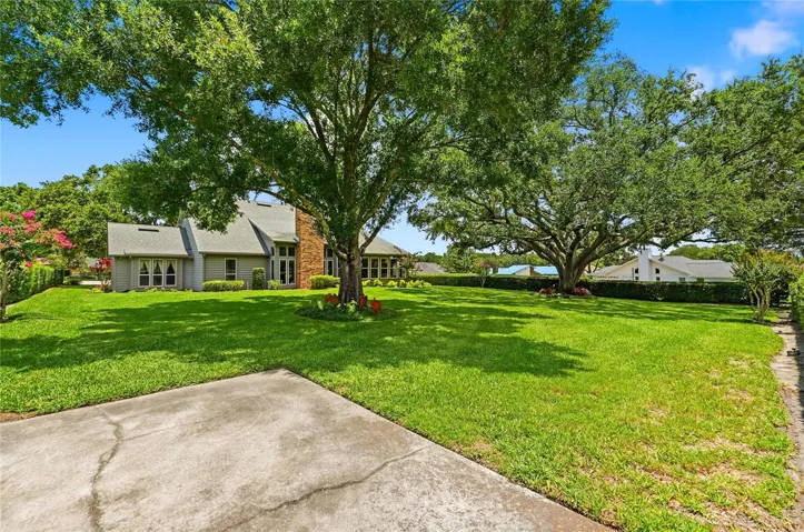 Park Like Backyard Setting Meticulously Maintained Landscaping and Trees.