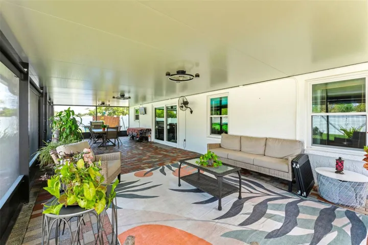 645 SF of Outdoor Living Space - Screened In Patio and Pavers Sealed in 2025, Outdoor Fans 2025, Privacy/Sun Shades 2025