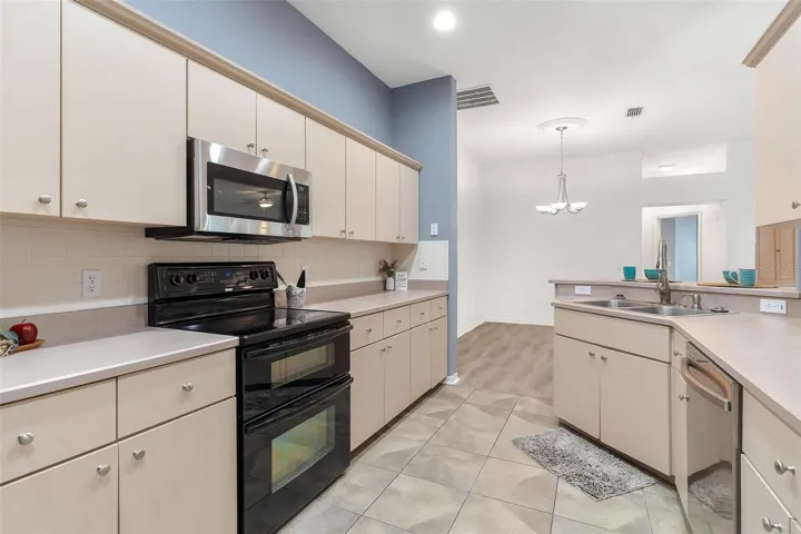 Kitchen over looks dining and living area.