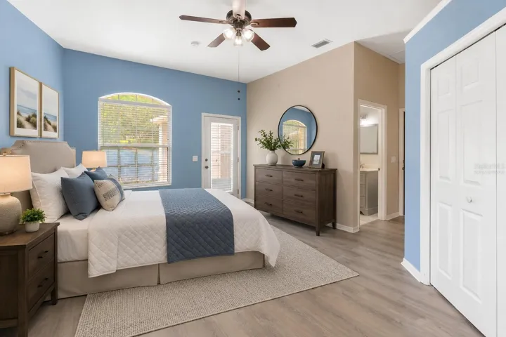 Virtually Staged-Primary Suite #2 features private entry,  wet bar, and built in storage.
