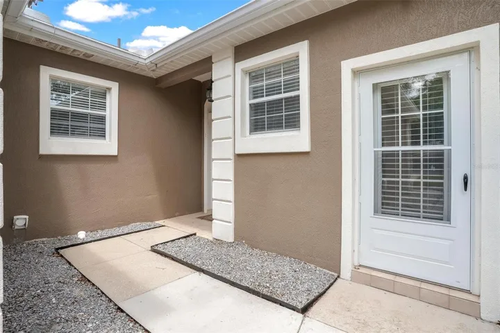 Side walk leading to front entry and private entry to Primary Suite #2